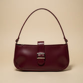 Chic Maroon Handbag with Modern Buckle