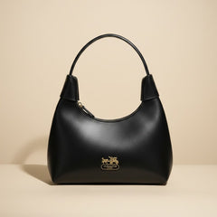 Elegant Black Leather Handbag with Gold Accents