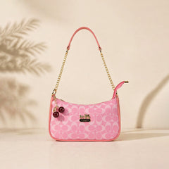 Chic Pink Coach Handbag with Cherry Charms