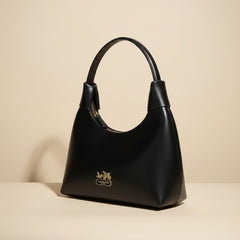 Elegant Black Leather Handbag with Gold Accents